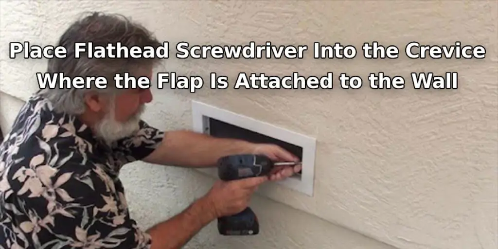 Place Flathead Screwdriver Into the Crevice Where the Flap Is Attached to the Wall
