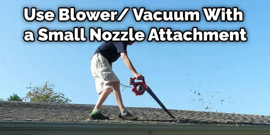 Use Blower/ Vacuum With  a Small Nozzle Attachment