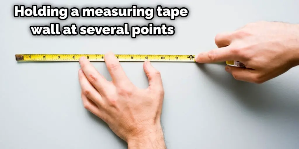 Holding a measuring tape wall at several points