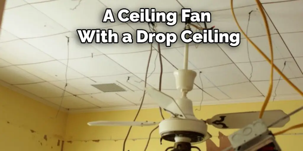 A Ceiling Fan  With a Drop Ceiling