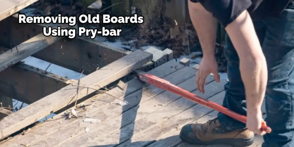 Removing Old Boards Using Pry-bar