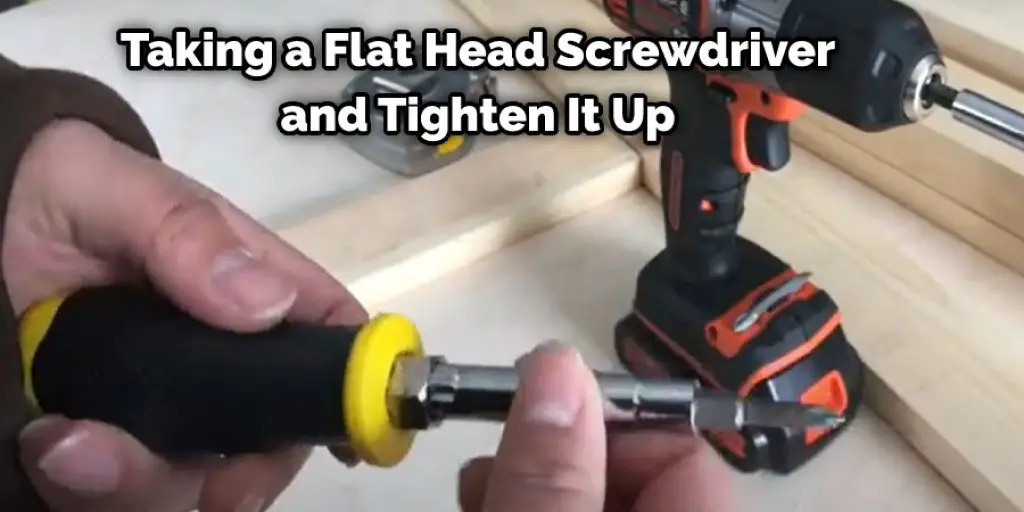 Taking a Flat Head Screwdriver and Tighten It Up