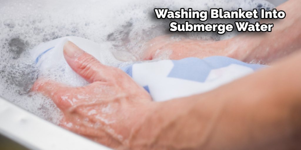 Washing Blanket Into Submerge Water