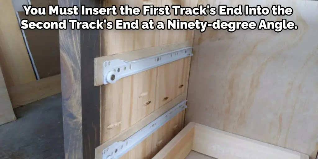You Must Insert the First Track's End Into the Second Track's End at a Ninety-degree Angle.