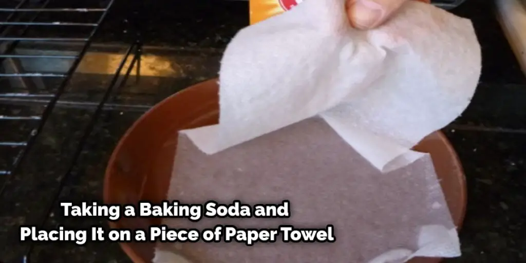 Taking a Baking Soda and Placing It on a Piece of Paper Towel