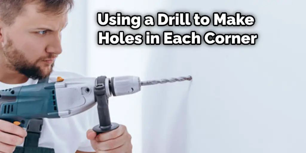 Using a Drill to Make Holes in Each Corner