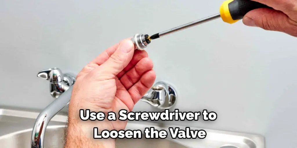 Use a Screwdriver to  Loosen the Valve