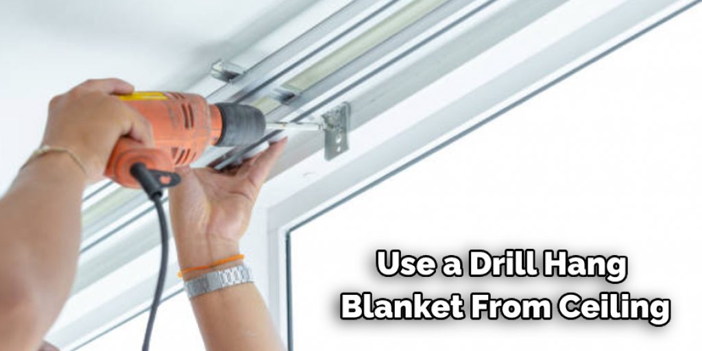 Use a Drill Hang  Blanket From Ceiling