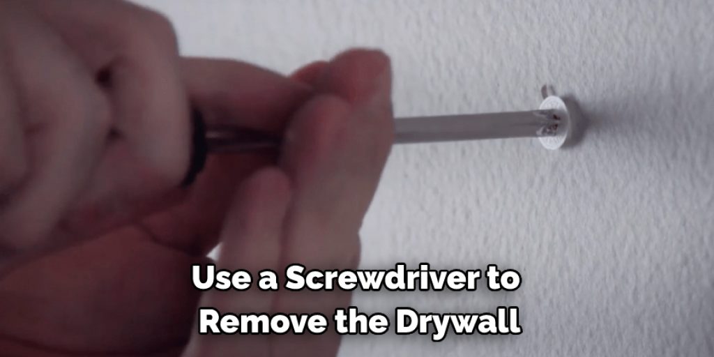 Use a Screwdriver to  Remove the Drywall