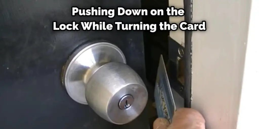 Pushing Down on the Lock While Turning the Card