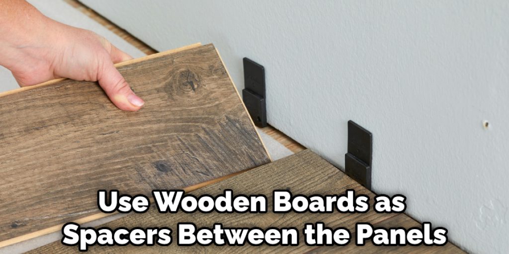 Use Wooden Boards as Spacers Between the Panels