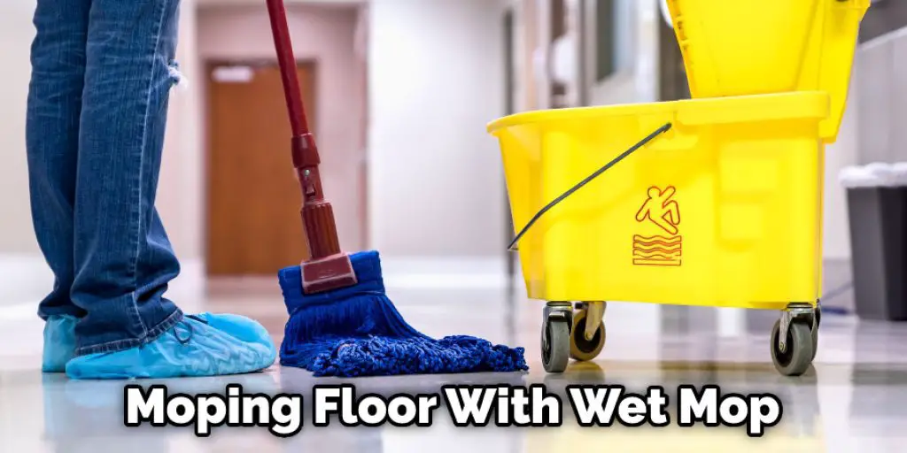 Moping Floor With Wet Mop