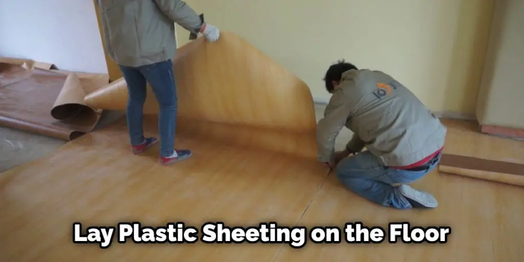 Lay Plastic Sheeting on the Floor