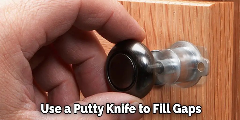 Use  a putty knife to fill gaps